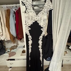 Betsy & Adam Black Gown with White Lace Details